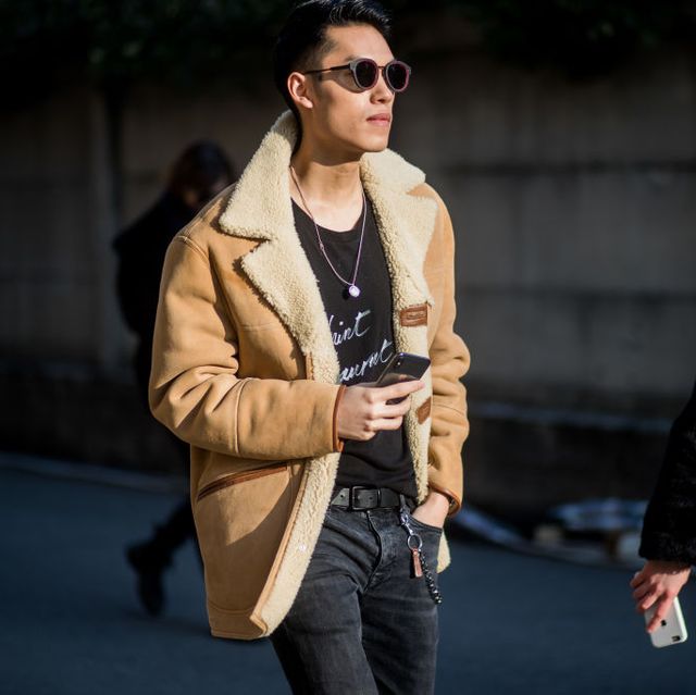 milan, italy   january 13 a guest wearing shearling jacket is seen outside diesel during milan mens fashion week fallwinter 201819 on january 13, 2018 in milan, italy photo by christian vieriggetty images