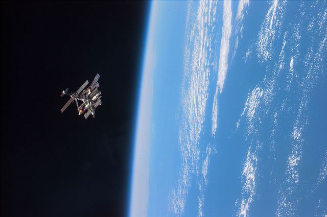 383927 03 file photo sts 79 astronauts enjoy this view of the mir complex backdropped against the blackness of space over earths horizon a thin blue line of airglow runs parallel with earths horizon, september 24, 1996 mir is nearing the end of its existence as russia plans to steer the craft out of orbit in late february 2001 in a controlled crash to dump the space station safely into the pacific ocean photo by nasanewsmakers