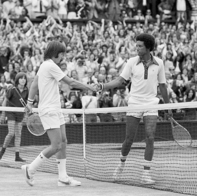 jimmy connors left shakes hands with arthur ashe after his defeat in the final which he lost in four sets 6 1, 6 1, 5 7, 6 4, 6th july 1975 photo by staffmirrorpixgetty images