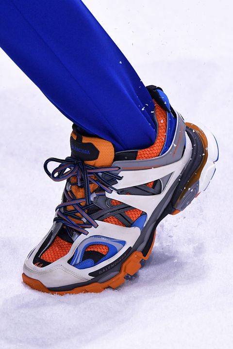 Footwear, Shoe, Ski boot, Orange, Athletic shoe, Boot, Electric blue, Cleat, Recreation, Snow, 