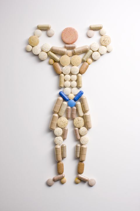 body builder shape made out of pills over head view, shoot in studio