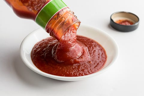 close up of ketchup over white background mens health bbq