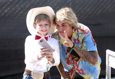 Mason Ramsey a.k.a. 'Walmart Yodeling Kid' and Justin Bieber.