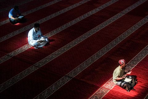 topshot   indonesian muslims read the koran at a mosque in bandung, west java, on may 23, 2018, during the month of ramadan   muslims throughout the world are marking the month of ramadan, the holiest month in the islamic calendar during which devotees fast from dawn till dusk photo by timur matahari  afp        photo credit should read timur matahariafp via getty images
