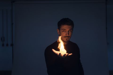 Portrait of magician with flame