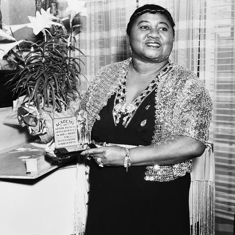 american actress hattie mcdaniel 1895   1952 with her academy award of merit for outstanding achievement, circa 1945 mcdaniel won an oscar for best supporting actress for her role of mammy in gone with the wind, making her the first african american to win an academy award photo via john kobal foundationgetty images