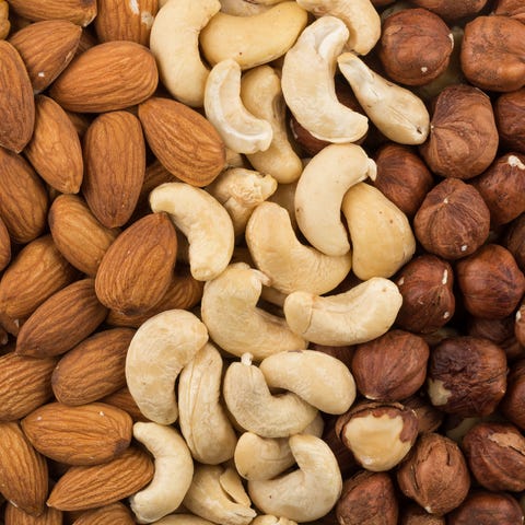 mixe of various nuts background above closeup