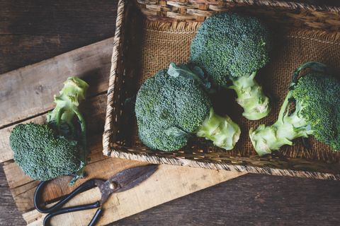 Close-Up Of Broccolis On Wooden Table