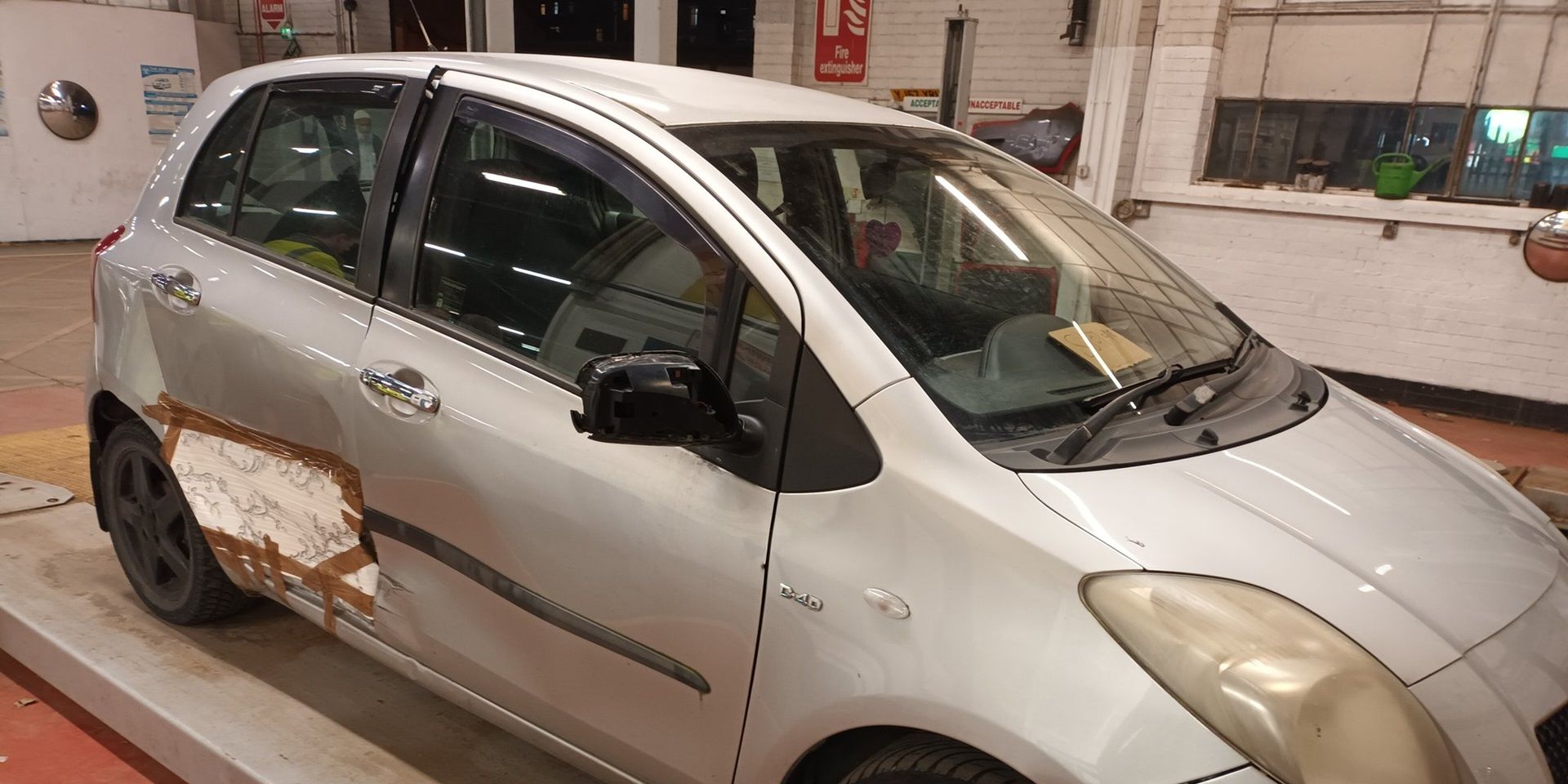 Police Stop and Tow Toyota Yaris Repaired with Wallpaper