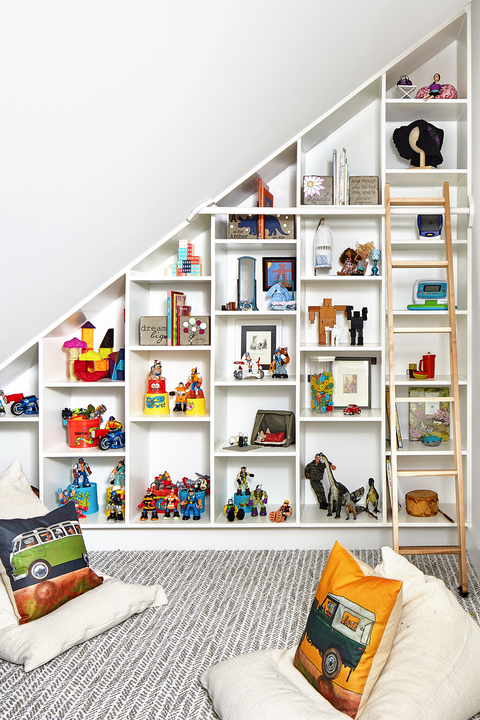 attic converted into playroom with open display shelves