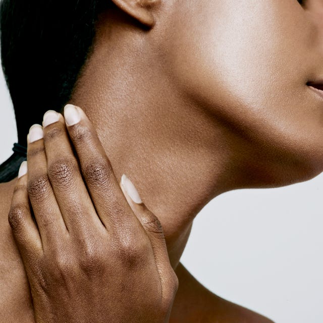 close up of woman holding neck, neck pain