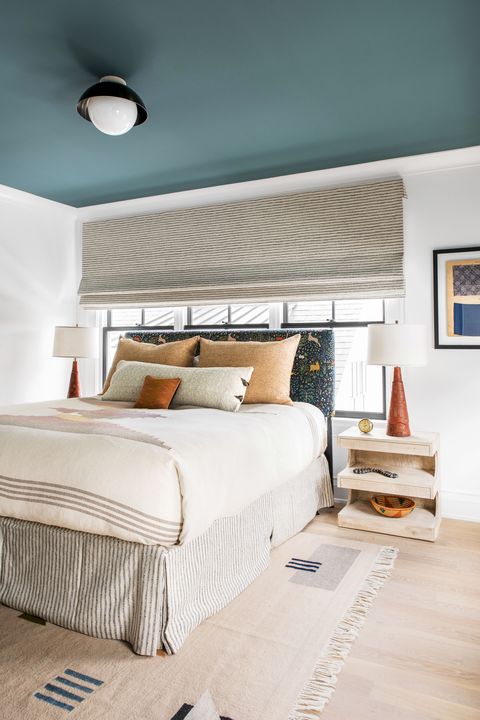 bedroom with blue ceiling designed by cortney bishop design