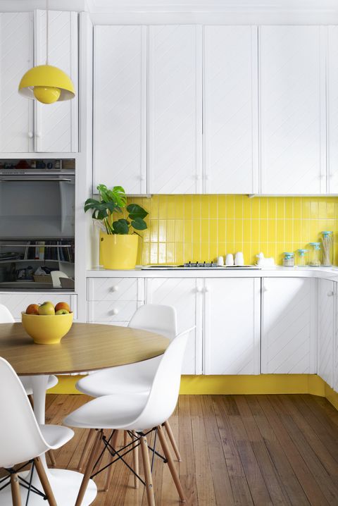 kitchen ideas white cabinets with yellow backsplash and floor board