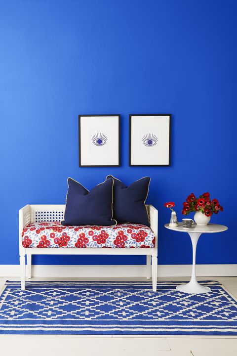 blue room with rattan bench
