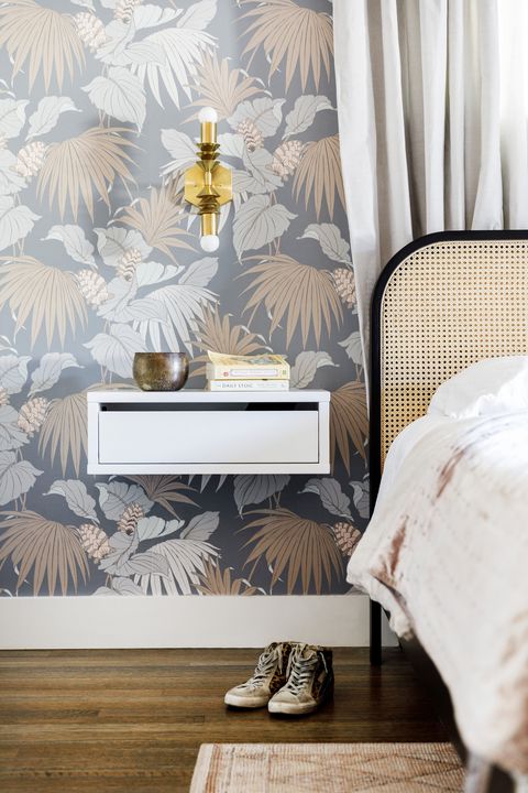 bedroom ideas with a white floating nightstand in the room with floral wallpaper on the walls