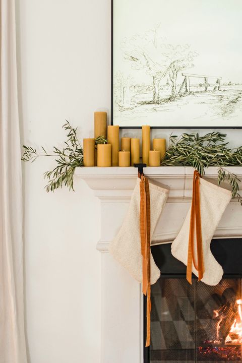 mantel with greenery and candles, fireplace, stockings, christmas, holiday decor
