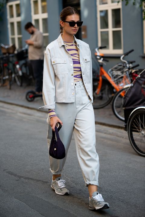 copenhagen, denmark   august 10 guest outside ganni wearing denim pants and jacket,sneakers and having black bag with her during copenhagen fashion week ss21 on august 10, 2020 in copenhagen, denmark photo by raimonda kulikauskienegetty images
