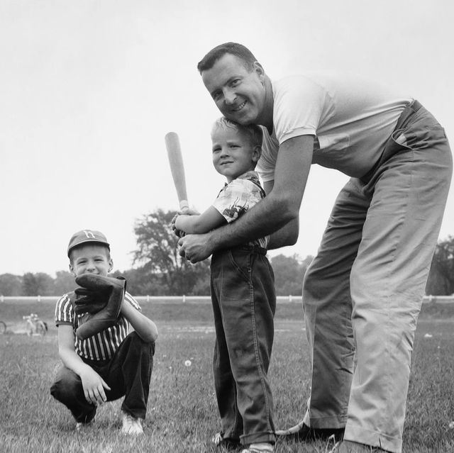 father and sons playing baseball