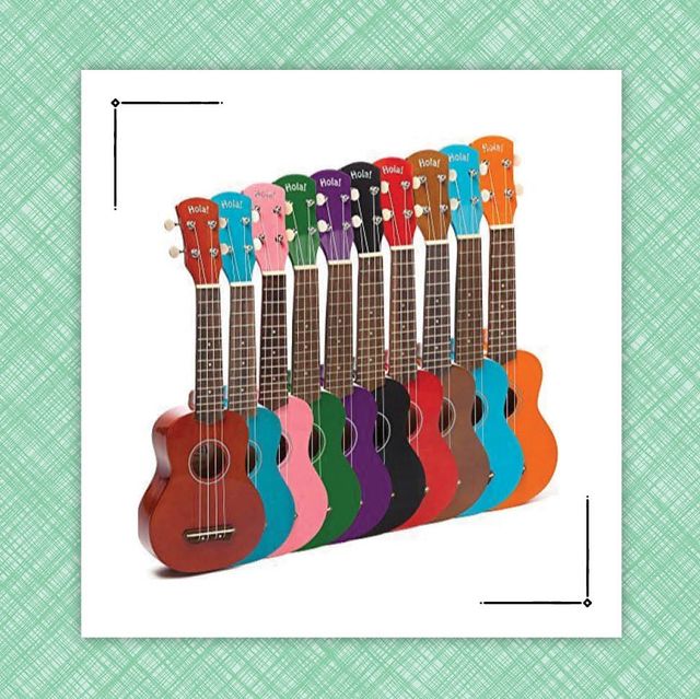 a group of ukuleles in a rainbow of colors and a blue glittery phone case