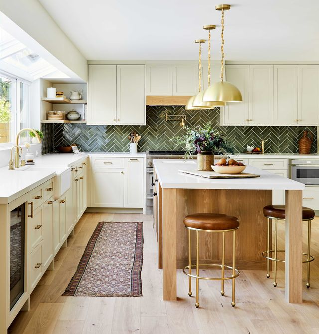 kitchen, cream cabinets, wooden kitchen island, green tiles, backsplash, leather brown stools