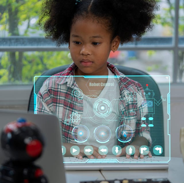 a girl thinking and analyzing a robot program