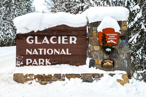 glacier national park sign with snow