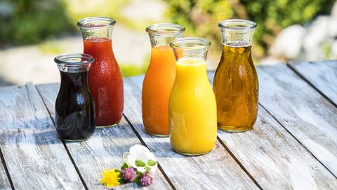 glass bottles of various fruit juices