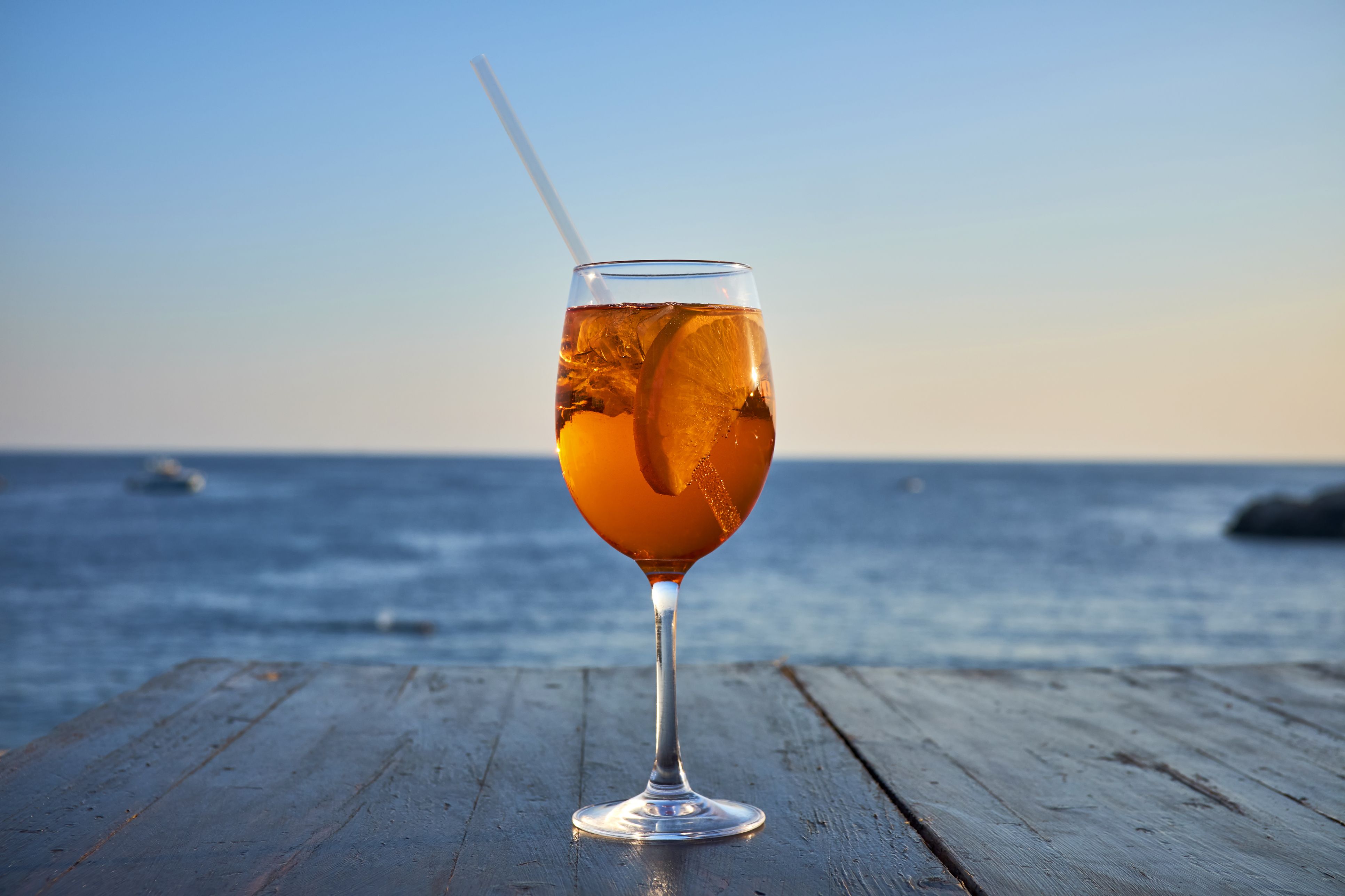 glass-of-ice-cooled-spritz-with-orange-slice-in-royalty-free-image-900233638-1533300393