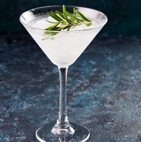 Glass of Martini coctail with fresh rosemary