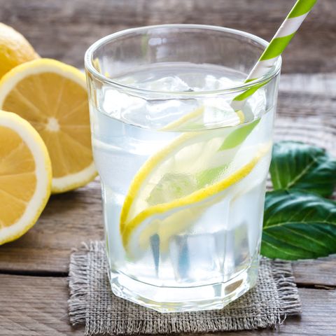 glass of water with fresh lemon juice royalty free image