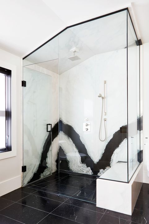black and white marble shower with glass doors