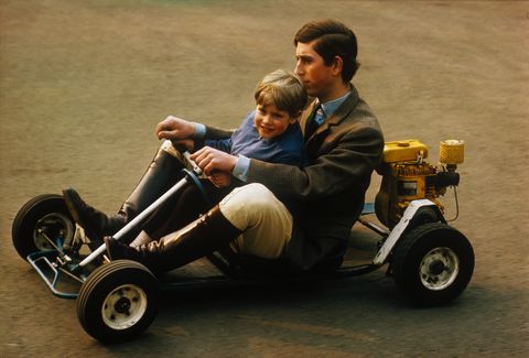 prince charles riding with brother in cart