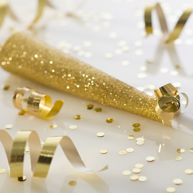 gold party horn and confetti