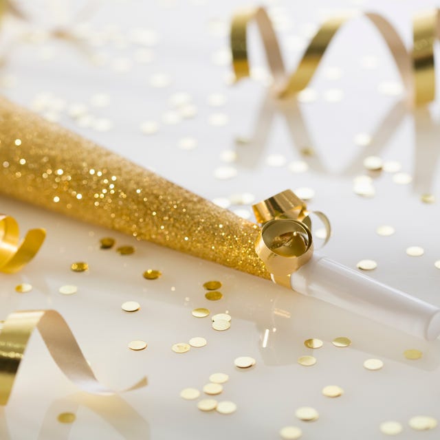 gold party horn and confetti