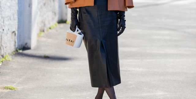 milan, italy   february 26 xiayan guo seen wearing brown jacket, black skirt with slit, tights, cropped top outside marni fashion show during the milan fashion week fallwinter 20222023 on february 26, 2022 in milan, italy photo by christian vieriggetty images