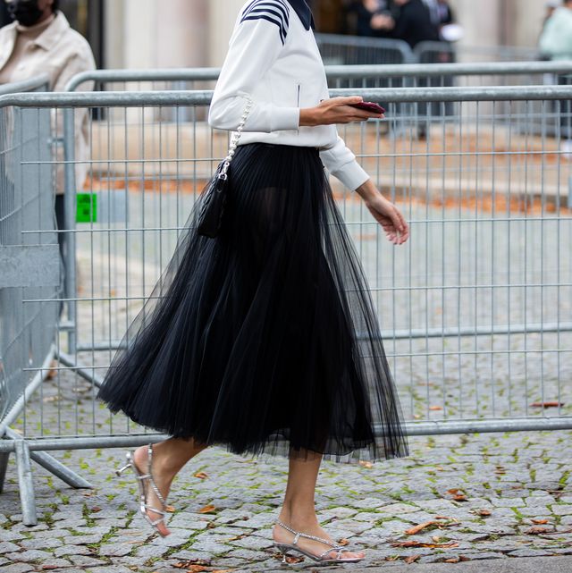 paris, france   october 05 alexa chung seen wearing black skirt, outside miu miu during paris fashion week   womenswear spring summer 2022 on october 05, 2021 in paris, france photo by christian vieriggetty images