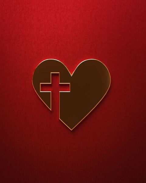 heart with cross cutout on red background