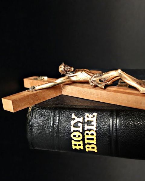 crucifix on top of bible