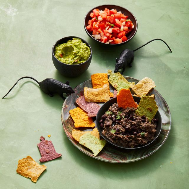 black bean graveyard dip with chips and toy rats