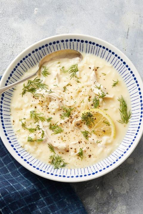 greek lemon chicken soup in white and blue bowl