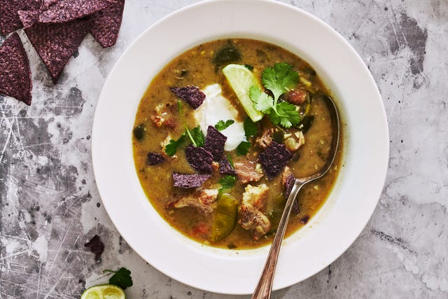 green chili pork stew topped with blue corn tortilla chips
