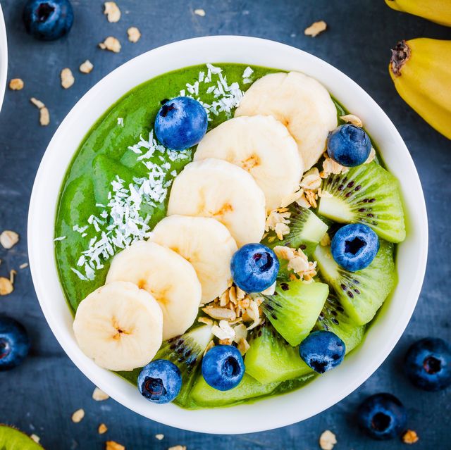 Green smoothie bowl with banana, kiwi, blueberry, granola