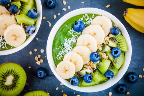 Green smoothie bowl with banana, kiwi, blueberry, granola