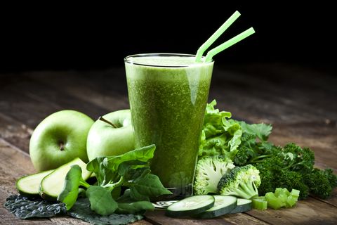 green vegetable juice on rustic wooden table