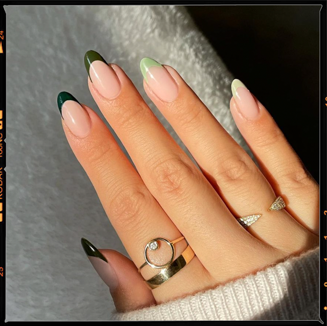 two hands with green nails, the one on the left has a black and green checkered pattern and the one on the right has green gradient french tips