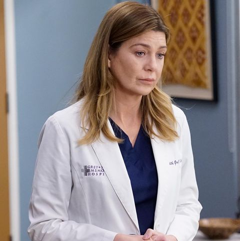 dr meredith grey in medical coat looking concerned