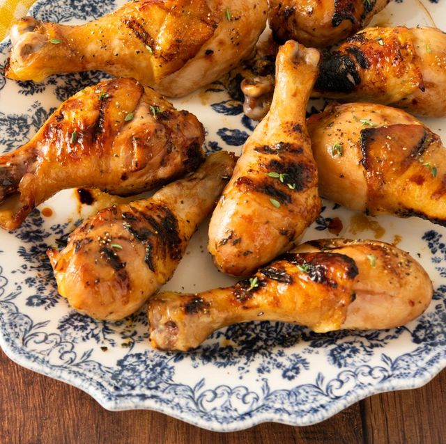 grilled chicken wings on blue and white plate with yellow checkered napkin