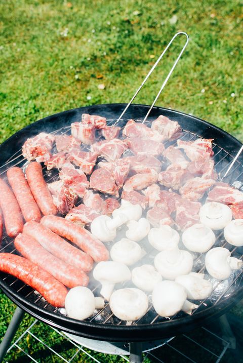 grilled meat, sausages and mushrooms bbq food in nature cooking food on the grill