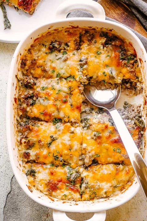 cheesy ground beef cauliflower rice casserole with silver spoon