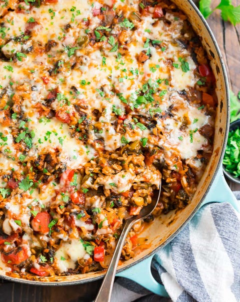 stuffed pepper casserole in baking dish with spoon